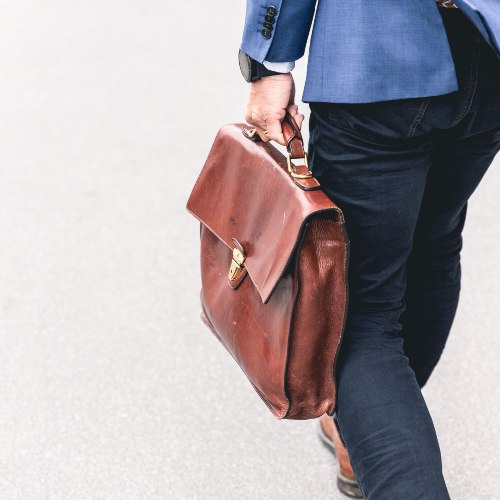 Picture of someone walking and their bag.