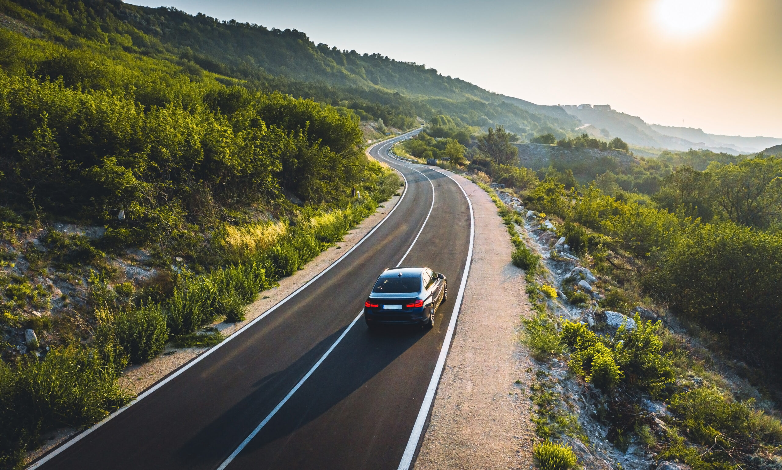 Car driving on road.