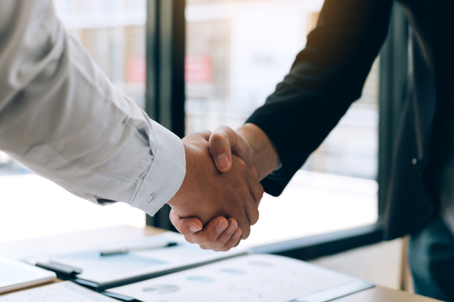 Two people shaking hands.